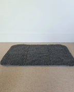 wool at folded up, and put into a black total bag